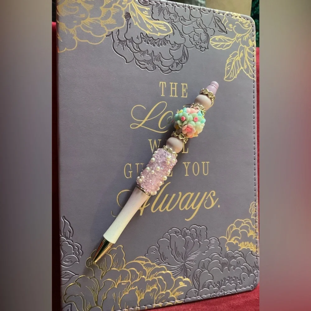 Floral Embossed Purple Journal with Hand Crafted Pen. Journal is 8.5 x 5.75”